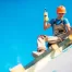 A professional roofer examines a residential roof for maintenance purposes, essential for Houston homeowners' roof care